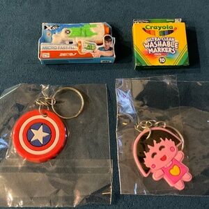 Miniature Bundle of water gun, Crayola  crayons, Captain Marvel Shield, anime